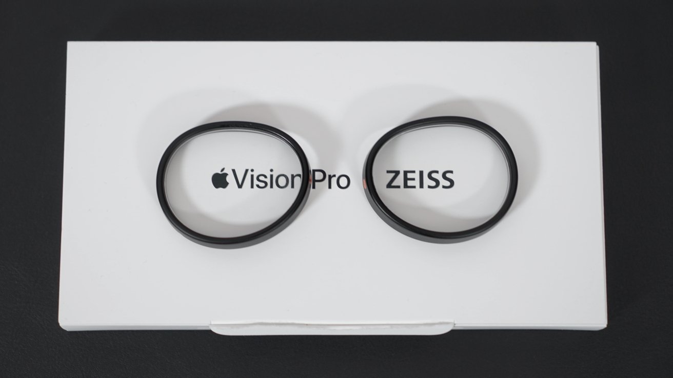 Optical inserts sitting on the packaging. The box says 'Apple Vision Pro | ZEISS'