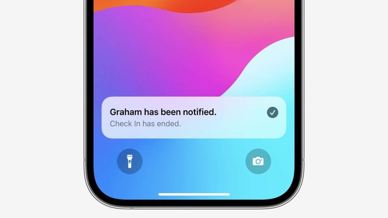 Smartphone screen showing a notification stating 'Graham has been notified. Check In has ended.', with a colorful background.