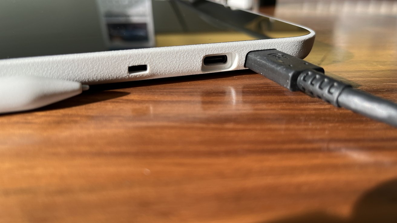 Close-up of the Wacom One with USB-C ports on a wooden surface.