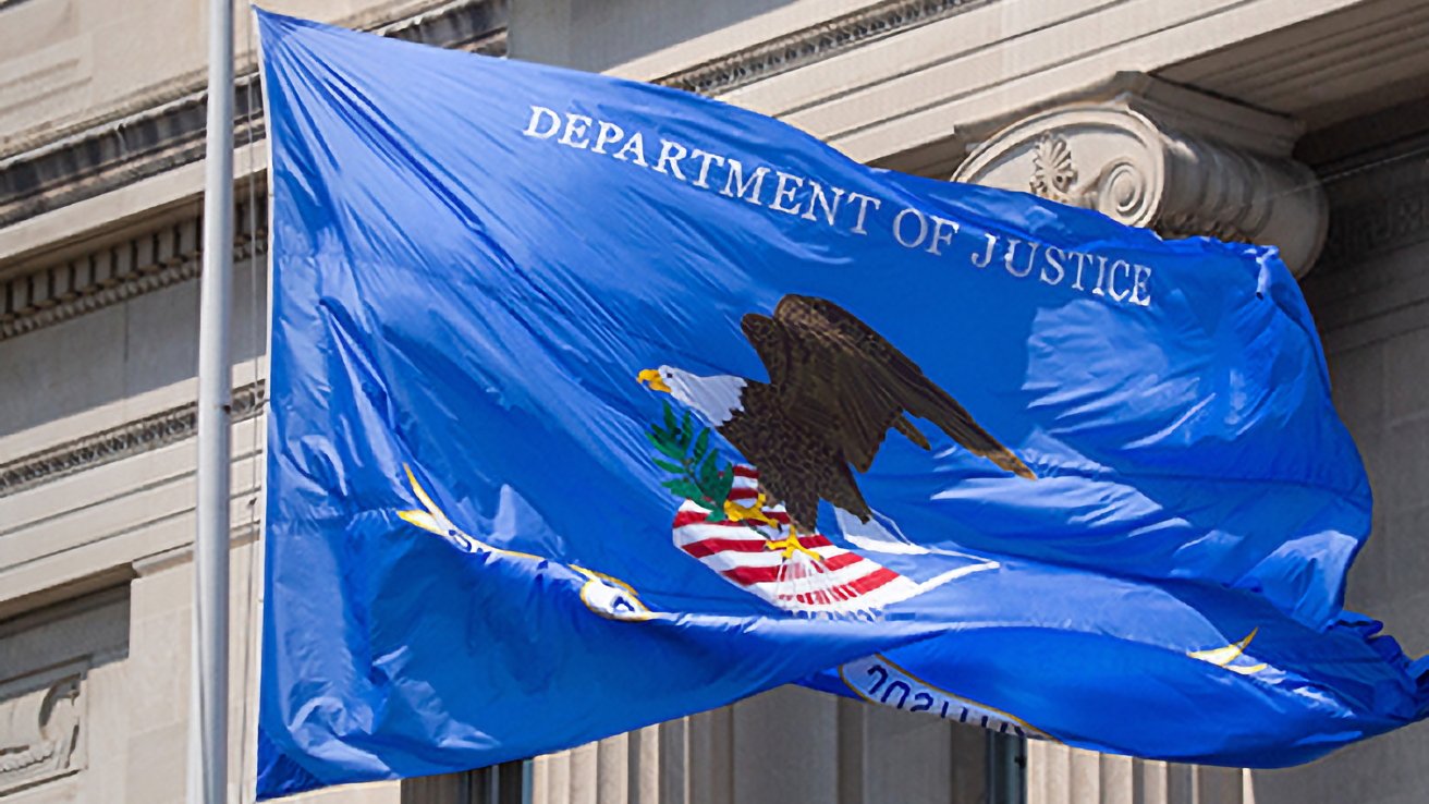 The US DOJ flag. It has an eagle clutching arrows and a branch against the red and white stripes of the American Flag, the background is blue.