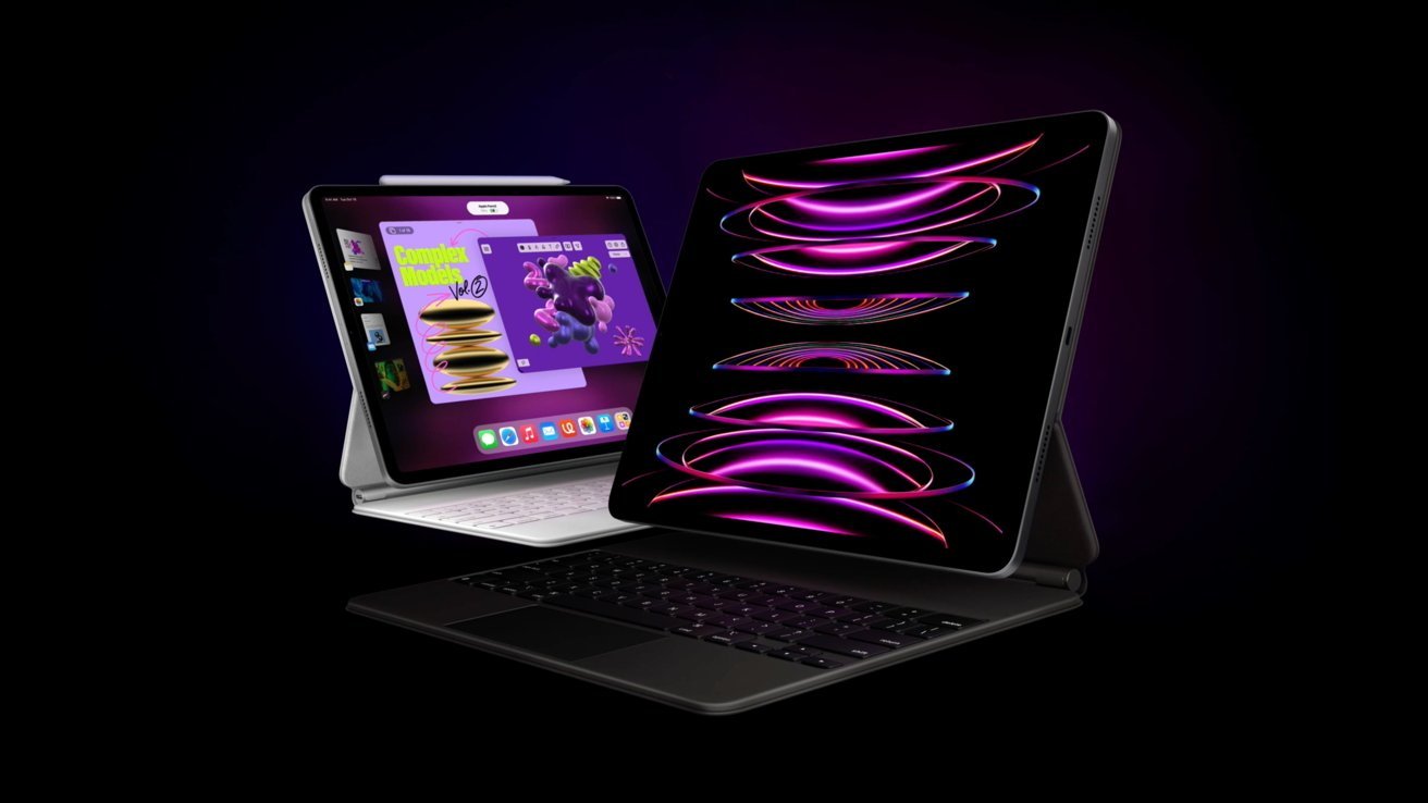 Pair of iPad Pros with colorful abstract swirls on screens against a dark background.