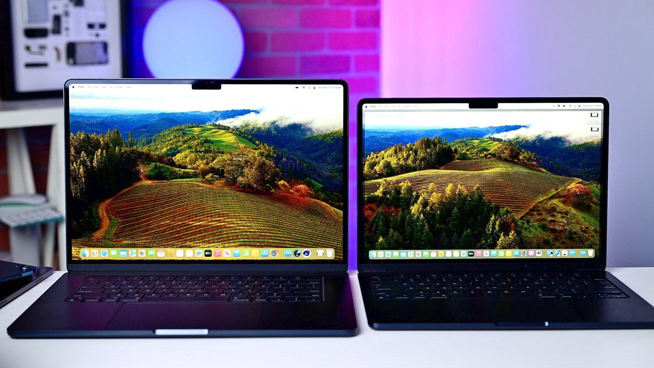 The 13-inch and 15-inch MacBook Airs sitting side by side with the screens open