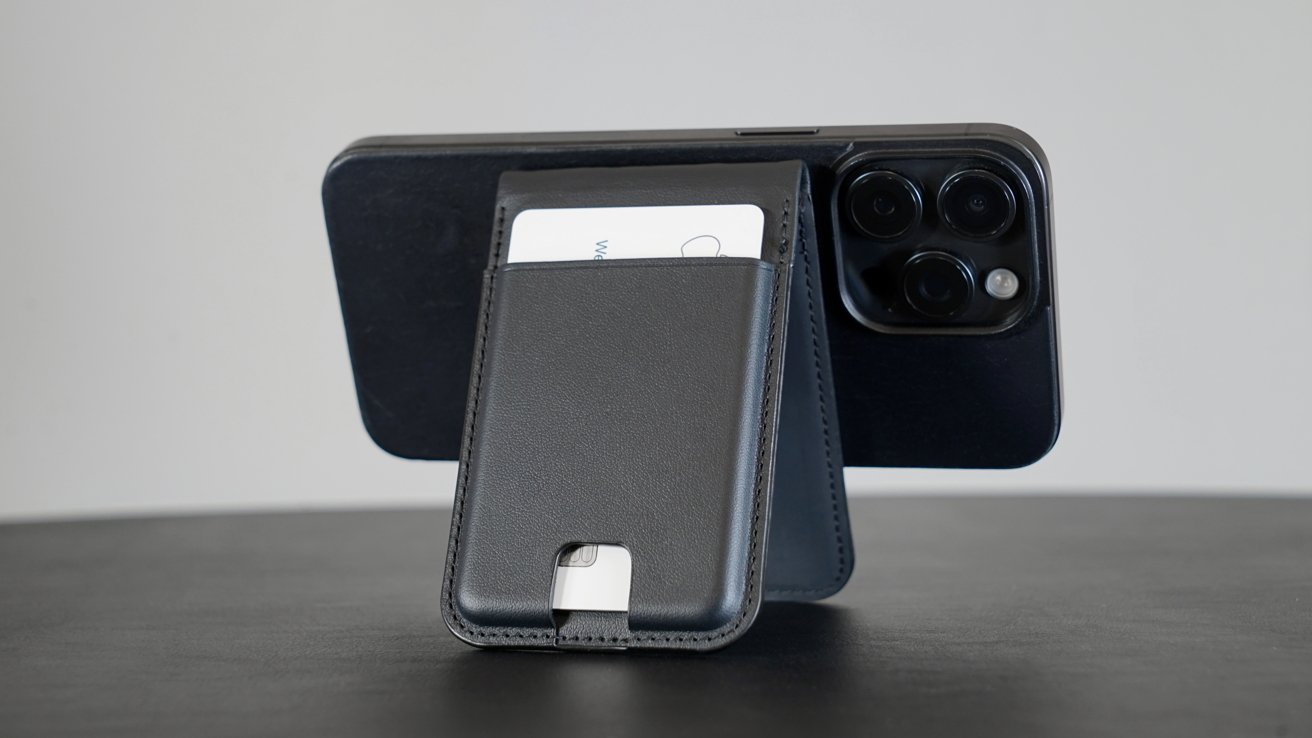 The Loc8 Wallet opened as a small MagSafe stand with the iPhone attached