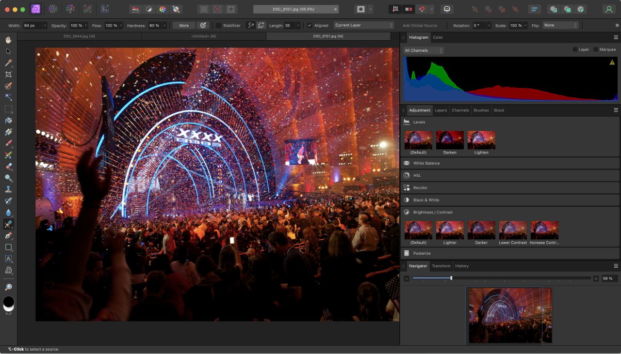 A crowded concert with colorful stage lights and confetti, being edited on a computer with graphic design software.