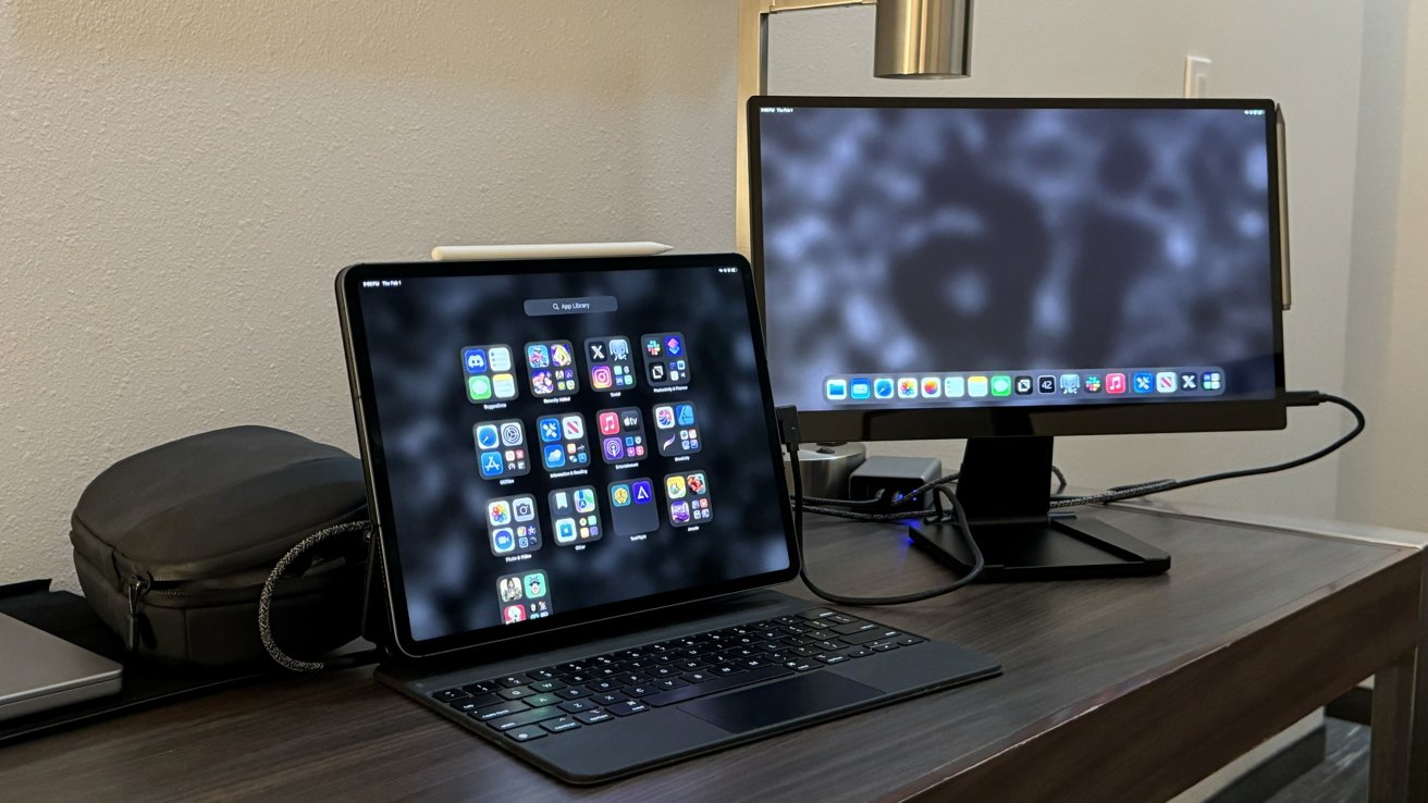 An iPad Pro with Magic Keyboard Case attached to a portable monitor