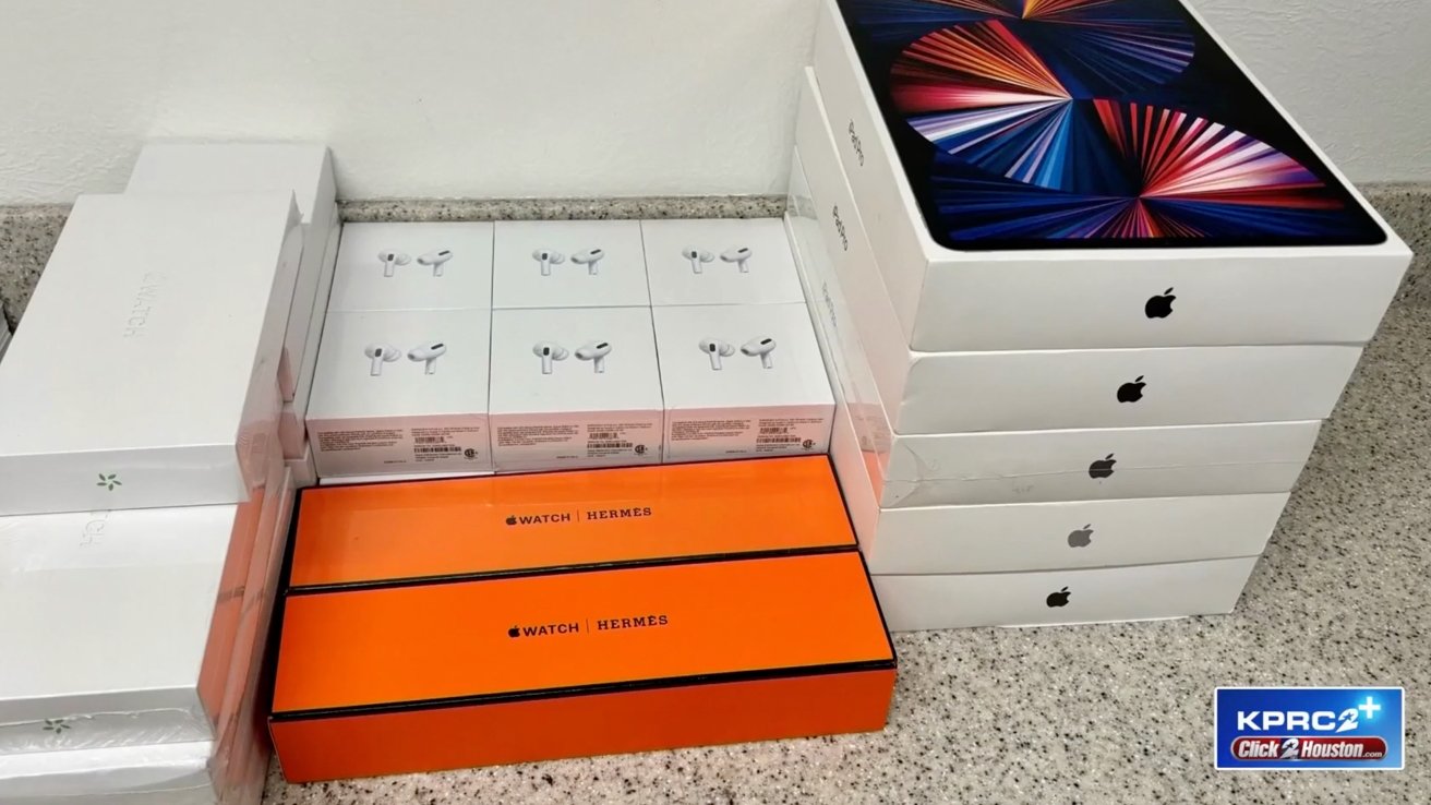 Assorted counterfeit Apple product boxes, including AirPods, Apple Watch Hermes, and an iPad Pro, arranged on a surface.