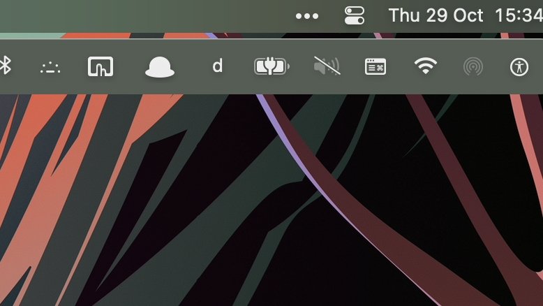 Screenshot showing a computer's taskbar with colorful abstract wallpaper and various icons indicating cloud storage, notifications, and Wi-Fi connectivity with the time displayed as 15:34.