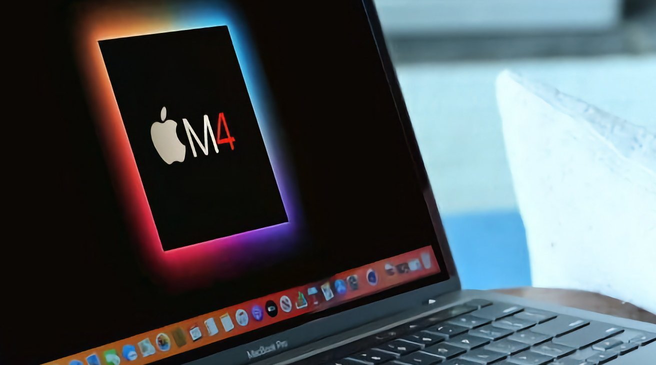 Laptop screen displaying a colorful Apple logo with the text 'M4' against a black background, on a desk beside a translucent object.