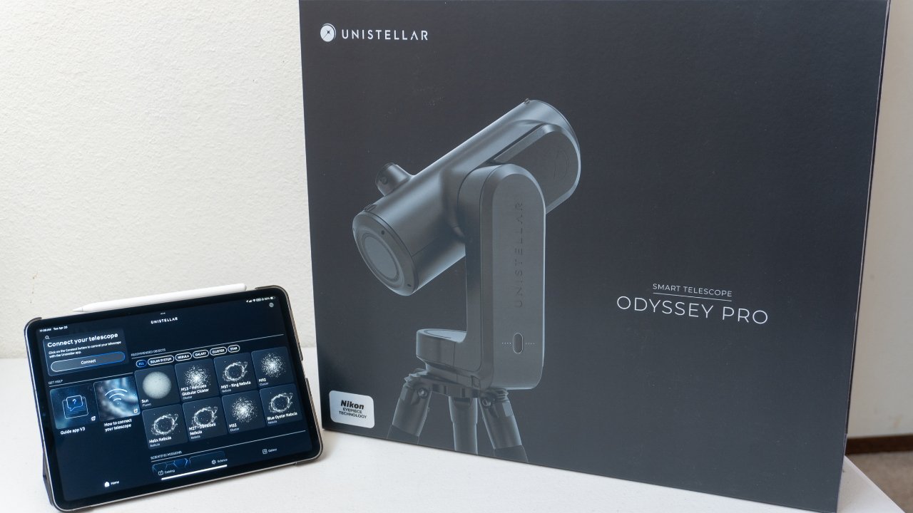 A tablet displaying an app next to a box labeled 'Unistellar, Smart Telescope Odyssey Pro' showing a graphic of the telescope.