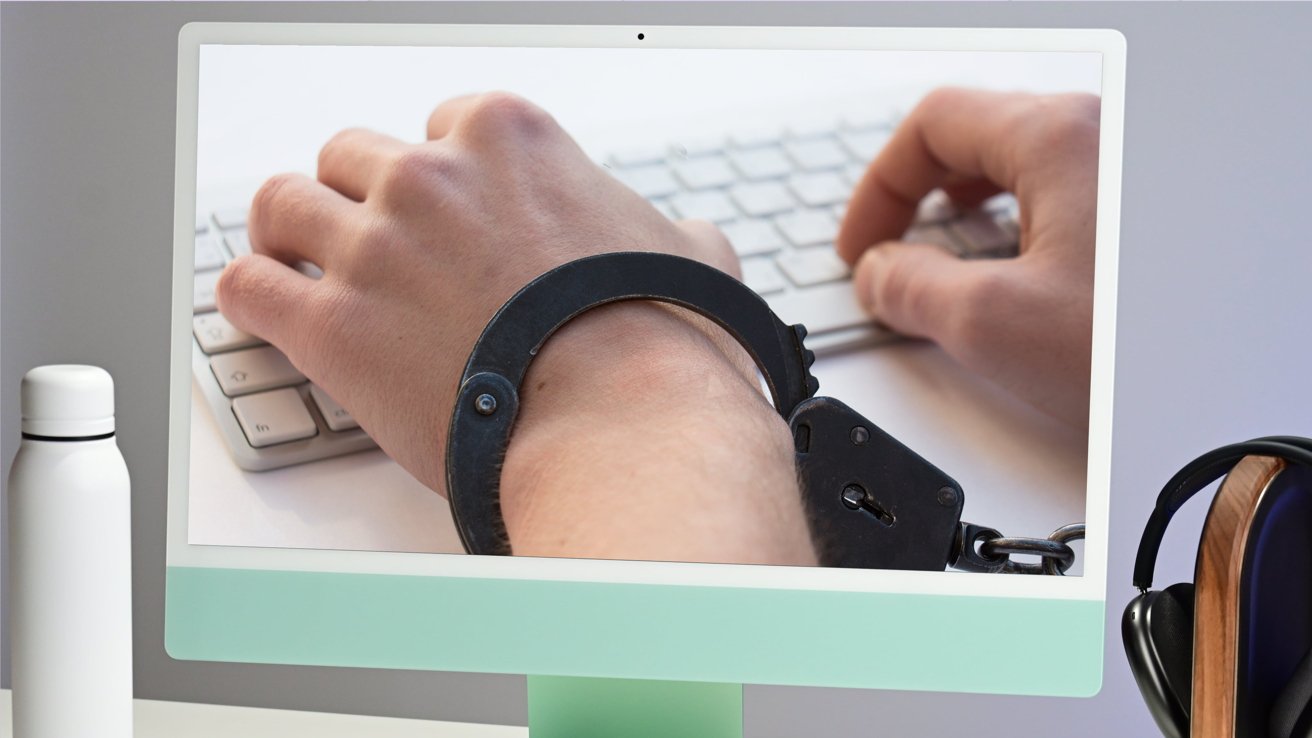 An iMac displaying hands in handcuffs