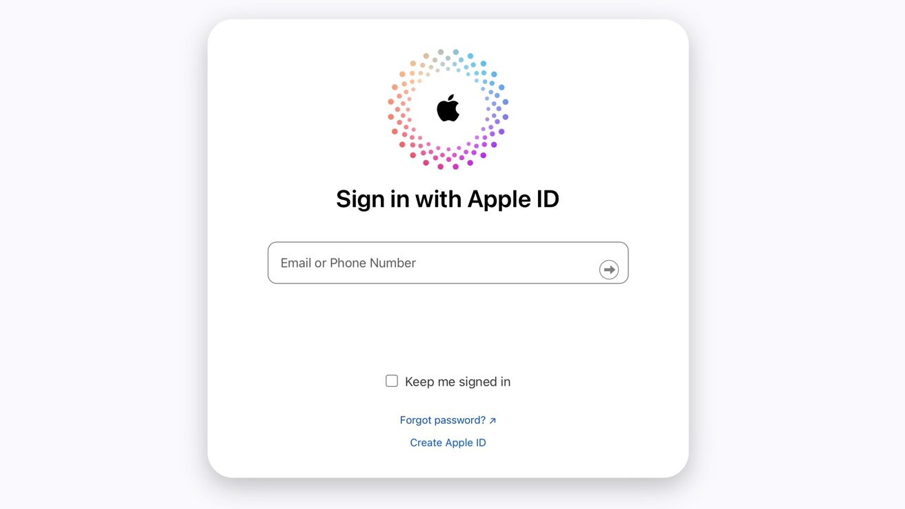 Apple ID sign-in interface with logo, input fields for email or phone number, and options to keep signed in, recover password, or create an Apple ID.