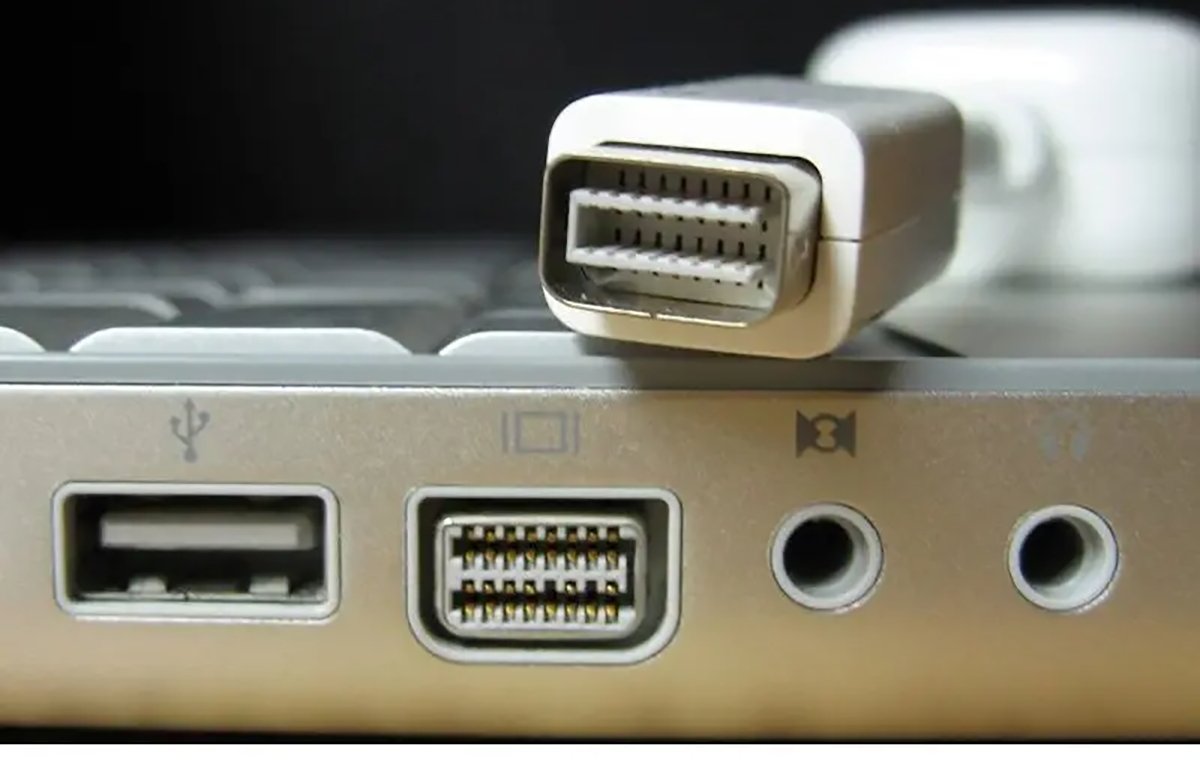 mini DVI and adapter for an Apple PowerBook computer.
