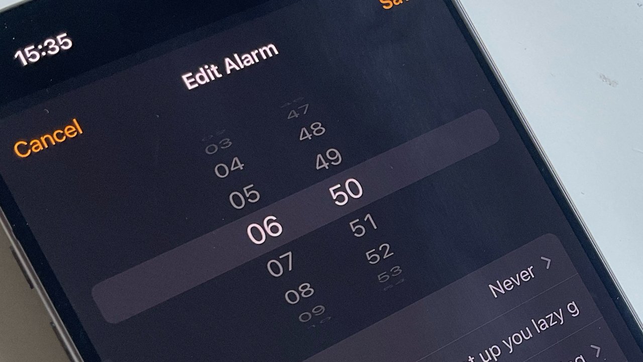 Smartphone screen displaying 'Edit Alarm' with times listed and an alarm label reading 'get up you lazy g'.