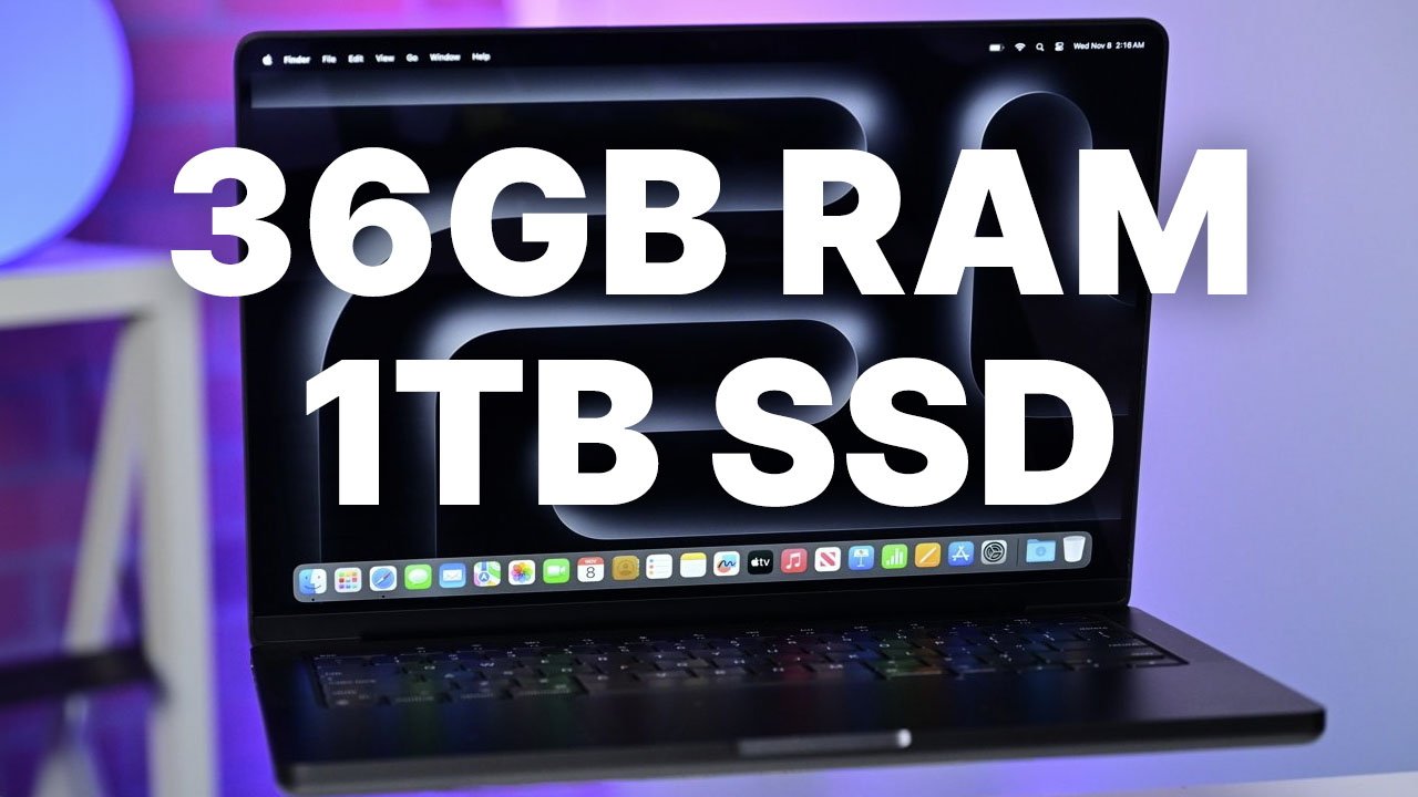 14-inch MacBook Pro with text overlay indicating '36GB RAM 1TB SSD' on screen, positioned on a desk with a blurred purple background.