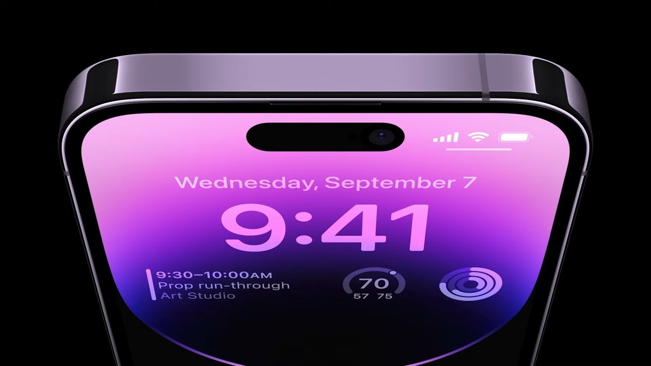 Close-up of an iPhone's notch display showing the time 9:41, with a colorful purple gradient background.
