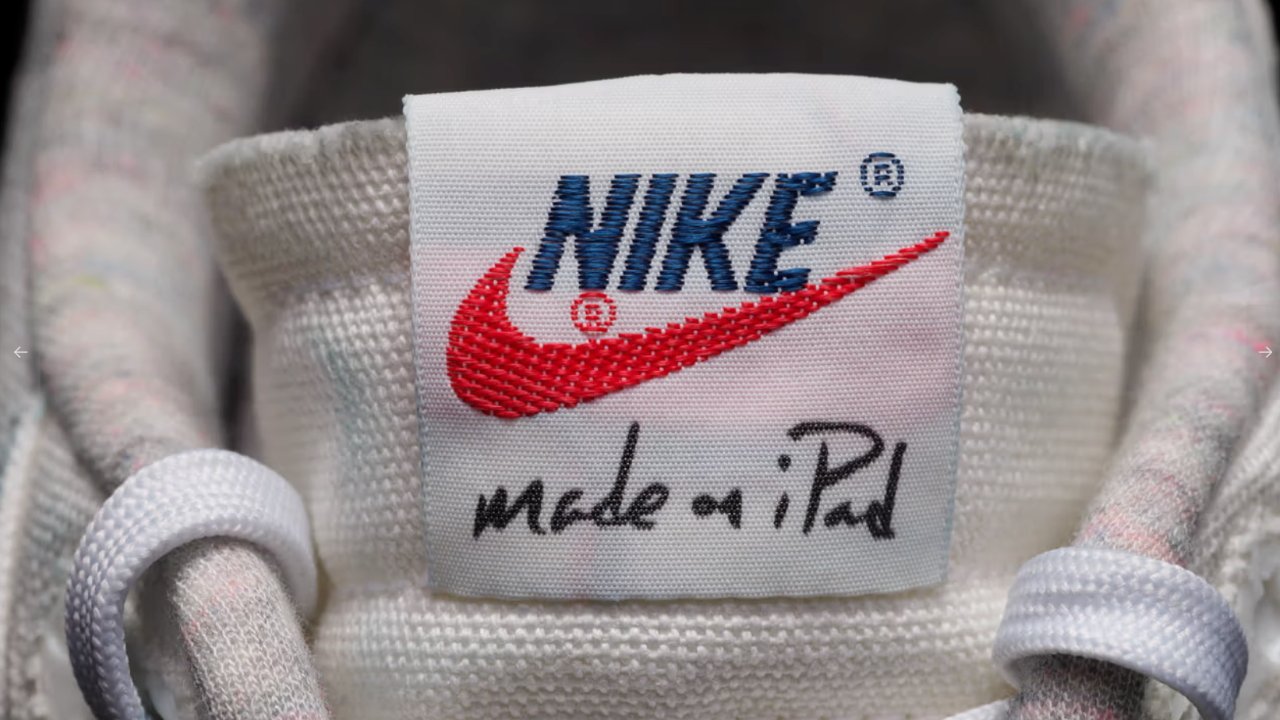 Close-up of a Nike shoe tongue label with the iconic swoosh logo and handwritten text 'made in Pad'.