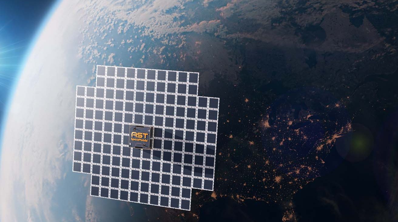 A satellite with solar panels orbits Earth, with the planet's curvature and city lights visible below.