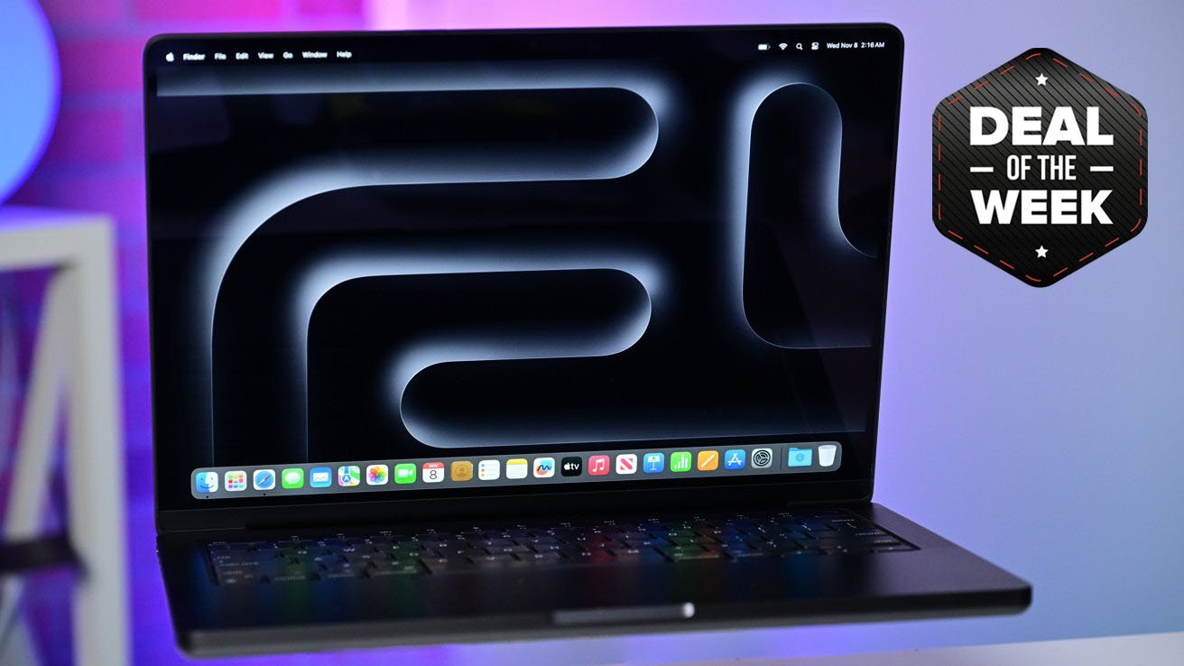 Apple 14-inch MacBook Pro in Space Black on a desk displaying abstract wallpaper with a 'Deal of the Week' badge in the top right corner.