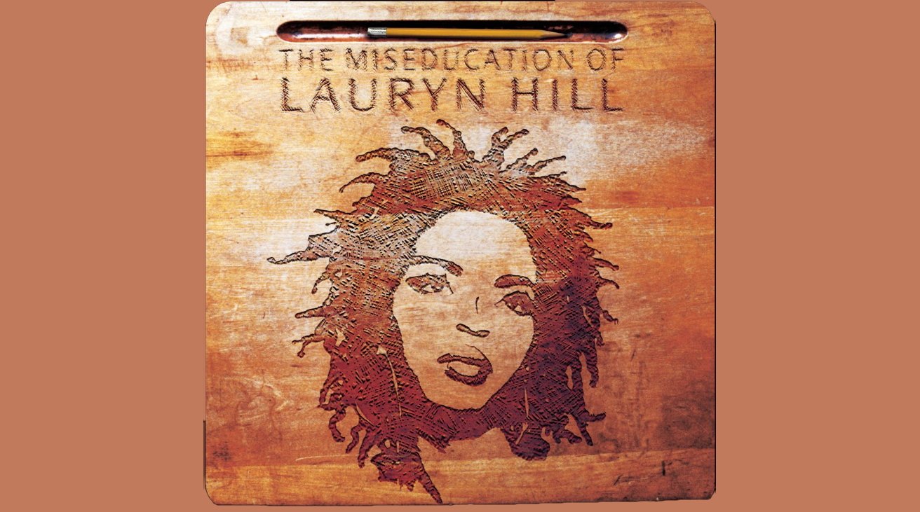 Wooden tablet carved with a woman's face and hair, titled 'The Miseducation of Lauryn Hill.'