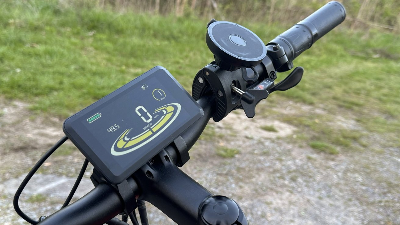 A view of the right side of the handlebar of Heybike Hero. The shifter, an iPhone mount, and the display are visible.
