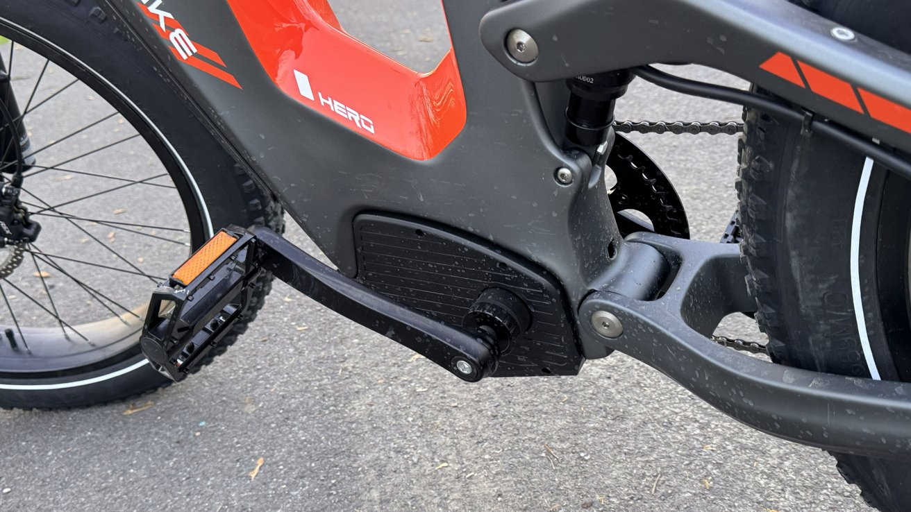 A close up photo of the pedals on Heybike Hero. Splatter from water is visible.