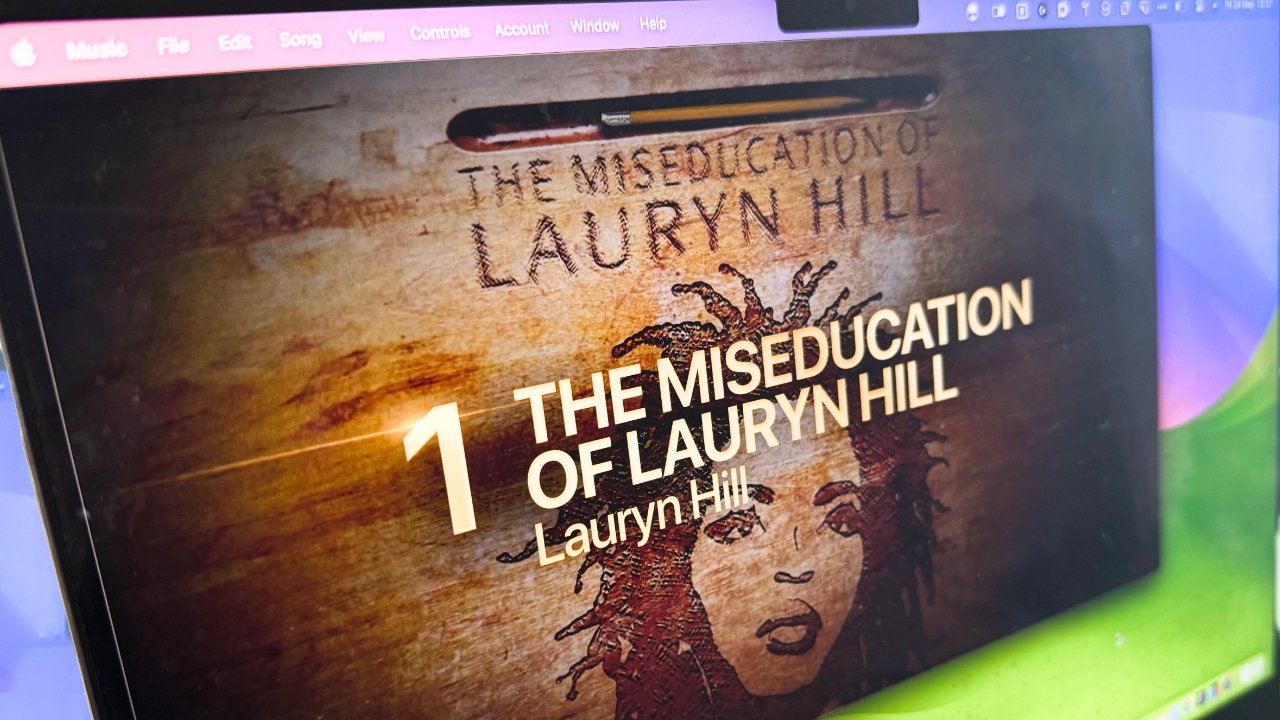 Album cover artwork for 'The Miseducation of Lauryn Hill' on a computer screen featuring a carved portrait of Lauryn Hill with text above.