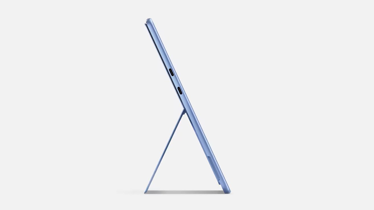 Side view of a blue tablet standing on a kickstand, showing its slim profile.