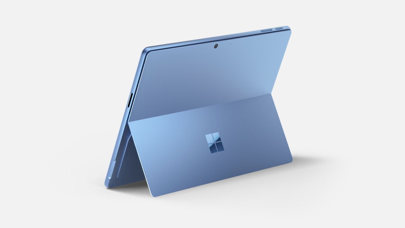 Blue tablet with a kickstand extended, revealing a Windows logo on the back.