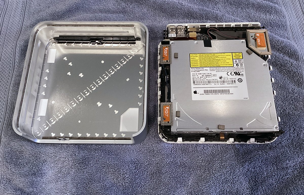 Opened Apple Mac mini with cover.