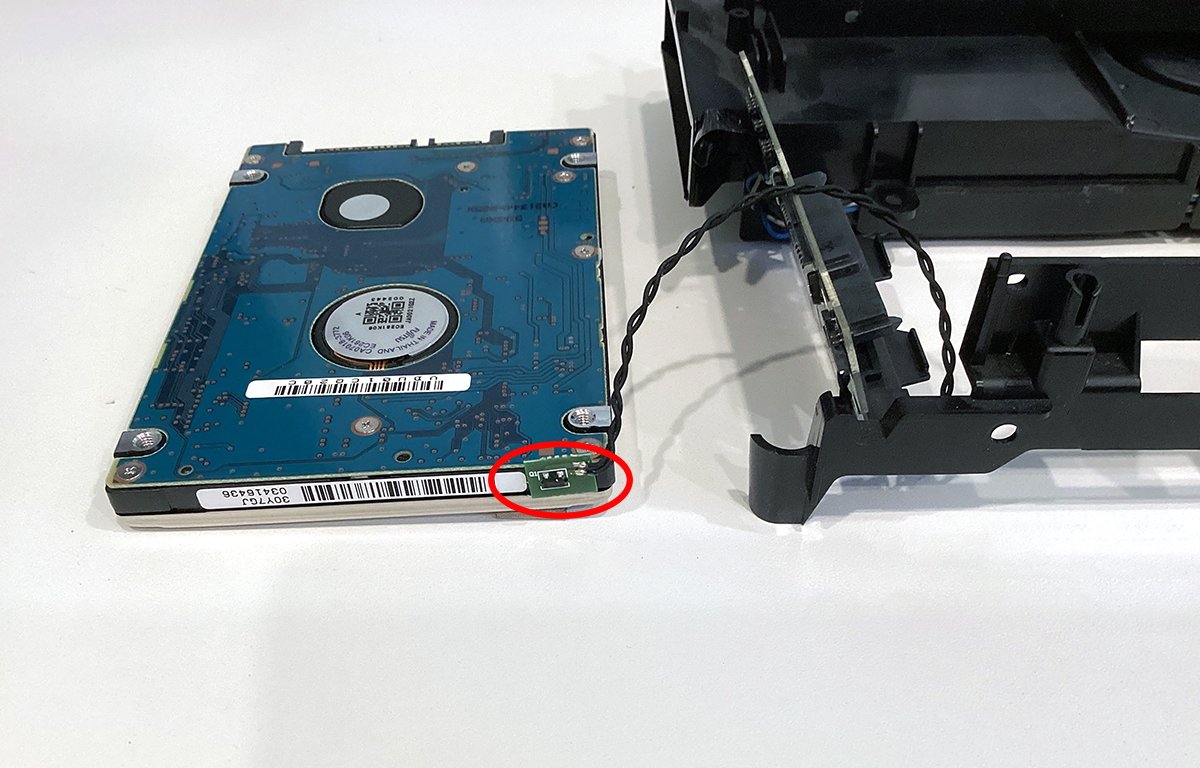 Mac mini hard drive with thermal sensor attached.