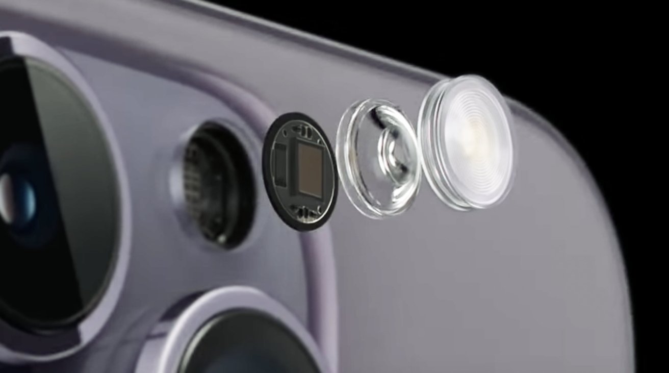 Close-up of a smartphone camera setup showing the lens, sensor, and flash components in a partially disassembled view.