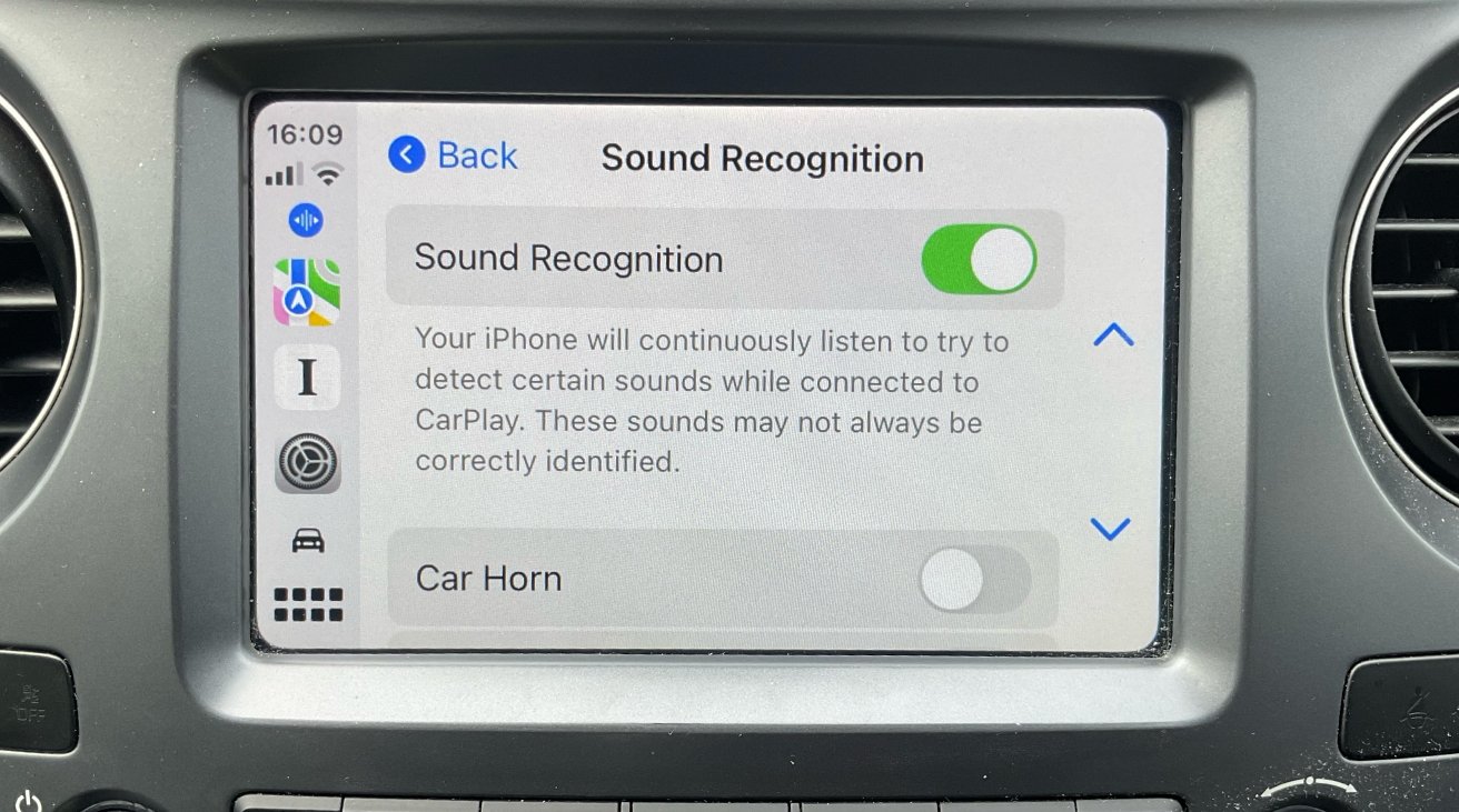 Car infotainment screen displaying iPhone sound recognition settings with sound recognition toggled on and car horn recognition toggled off. Various app icons are shown on the left side.