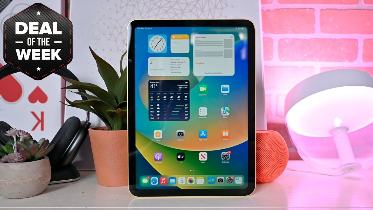 iPad 10th Generation on desk with plants, headphones, orange HomePod mini, and a lamp in the background; 'Deal of the Week' sign upper left.