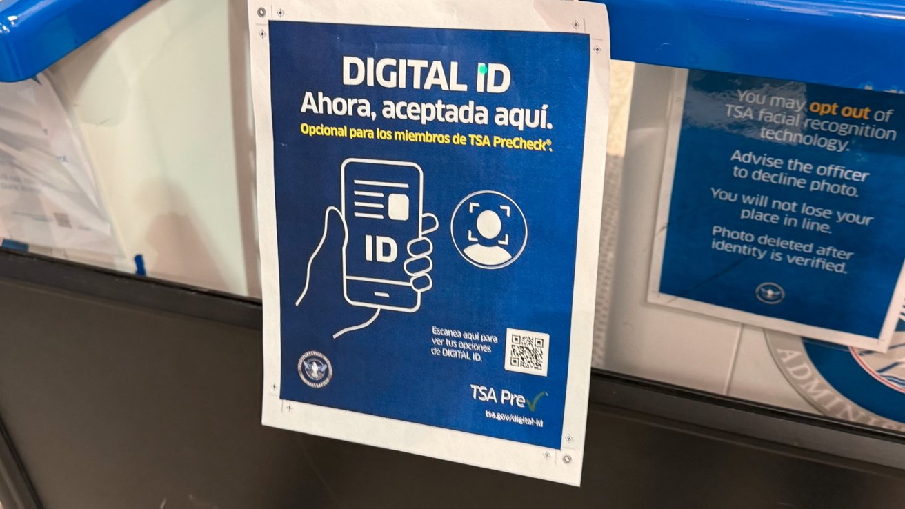 Sign promoting digital ID acceptance for TSA PreCheck members, featuring a hand holding a smartphone, ID icon, and text about opting out of facial recognition.