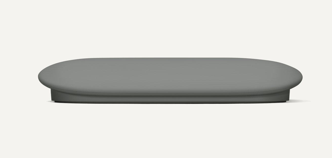 A rounded, gray, flat-topped device with a smooth surface, viewed from the front against a white background.