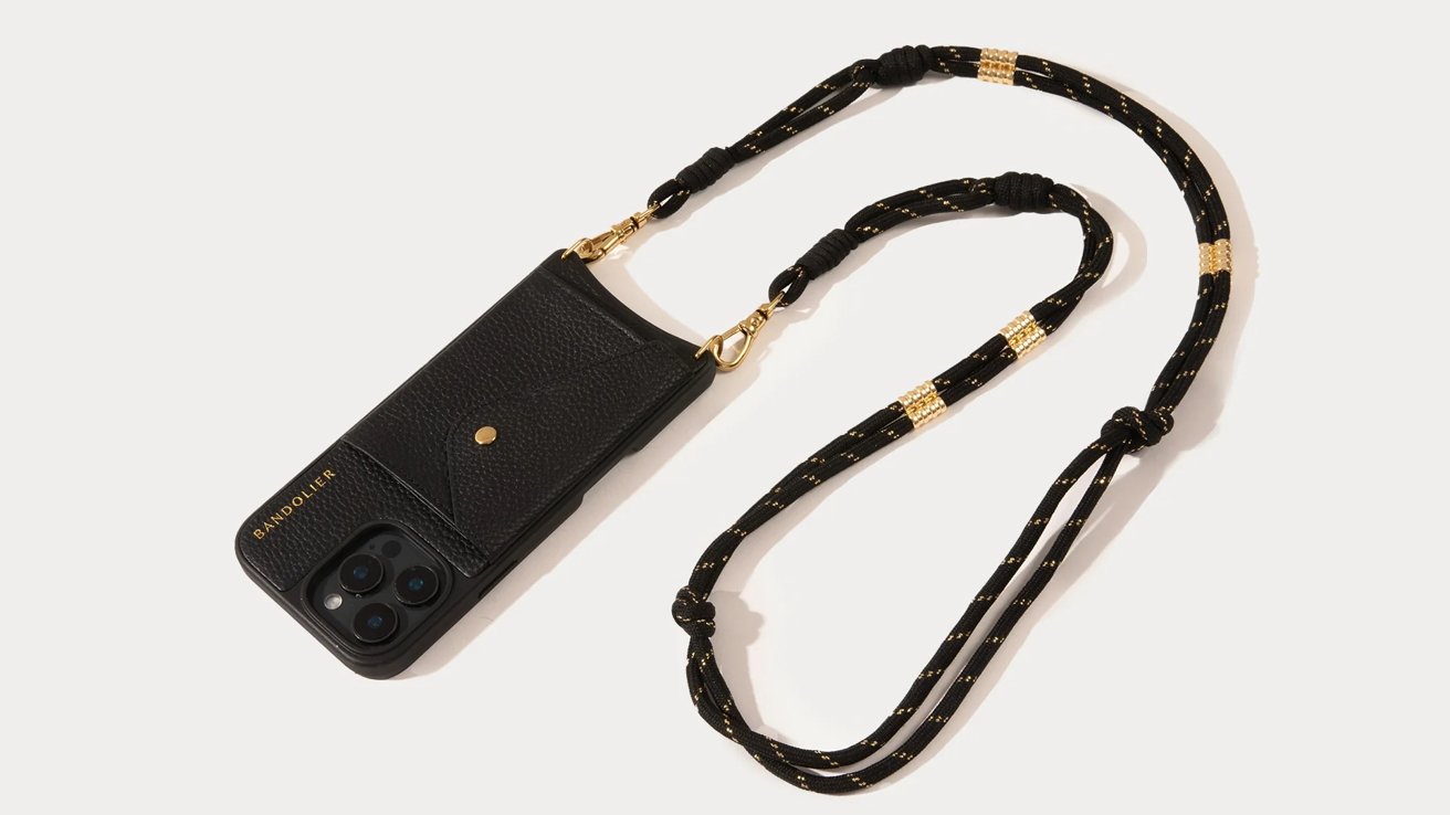 Black phone case with a pocket on a black and gold lanyard.