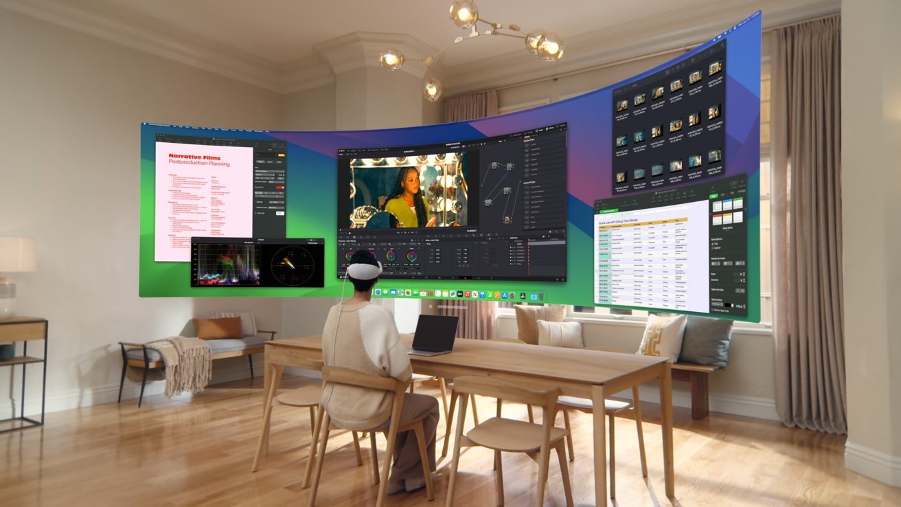 Person wearing VR headset at a wooden desk in a cozy living room, interacting with multiple floating virtual screens displaying various tasks.