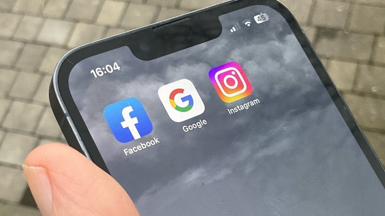 Close-up of a smartphone screen displaying the Facebook, Google, and Instagram app icons with a time of 16:04 on the top left corner.