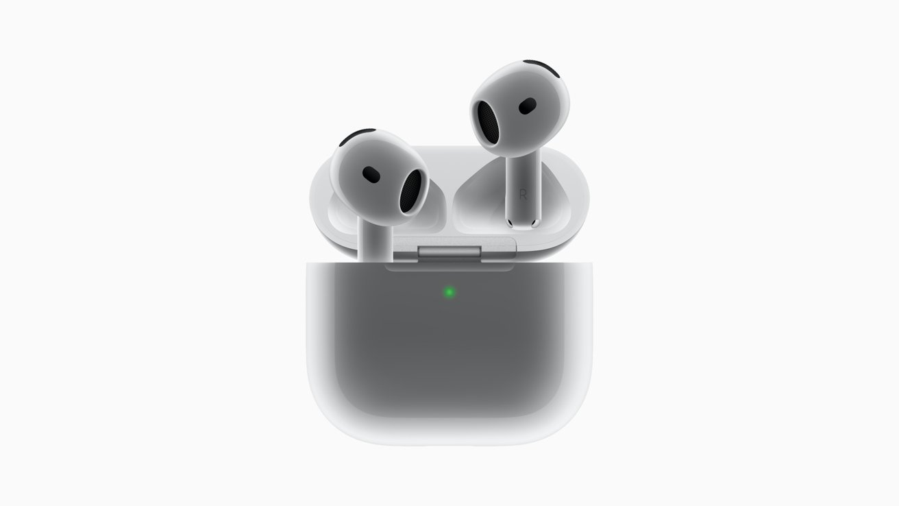 Wireless earbuds resting in an open charging case with a green LED indicator.