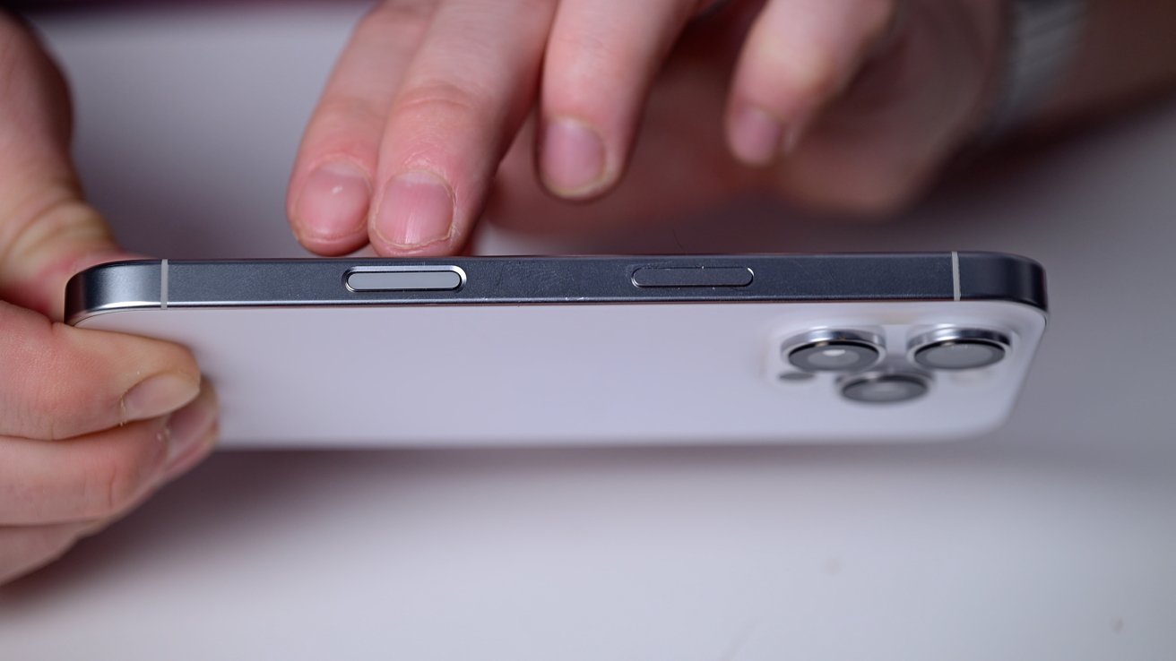 The new Camera Control button on the side of the white iPhone 16 Pro