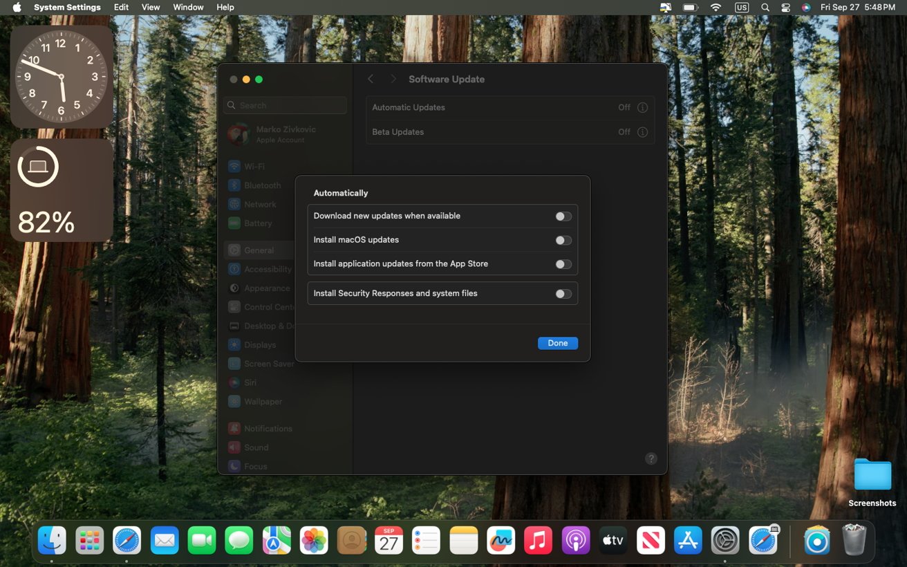 MacOS screen showing a software update settings window with automatic update options turned off, a clock, battery percentage, and forest wallpaper in the background