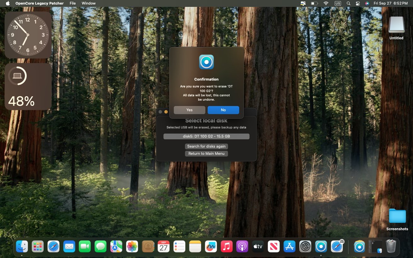 Computer screen with a forest background, confirmation prompt for erasing a USB drive, a clock showing 6:52 PM, and various desktop icons at the bottom.