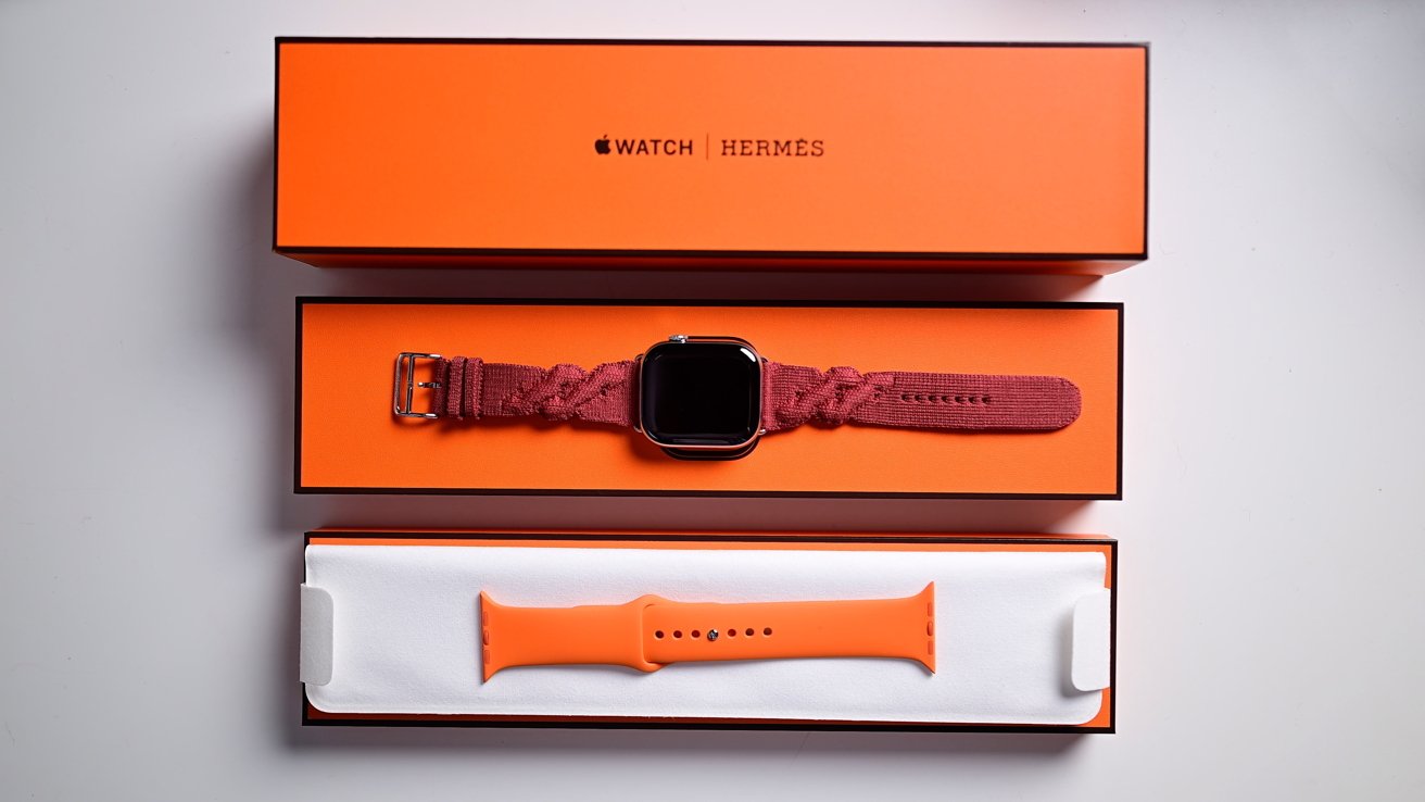 All the boxes and parts of the Hermes Apple Watch spread out on a table