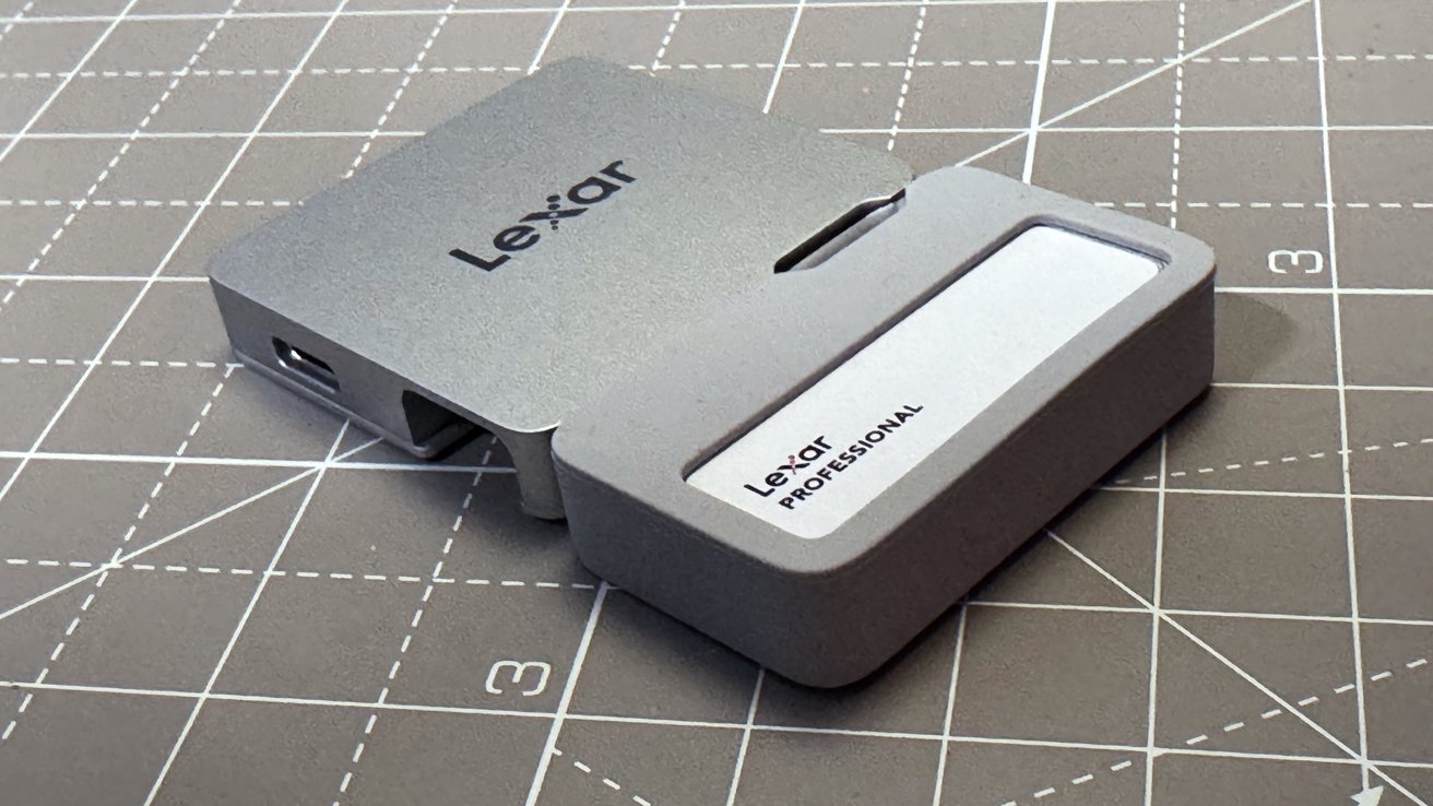 Silver Lexar Professional card reader with checkered surface.