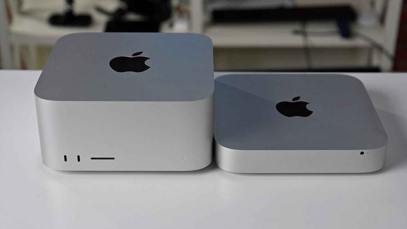 Two silver desktop computers with Apple logos, one larger and taller than the other, positioned side by side on a white surface.