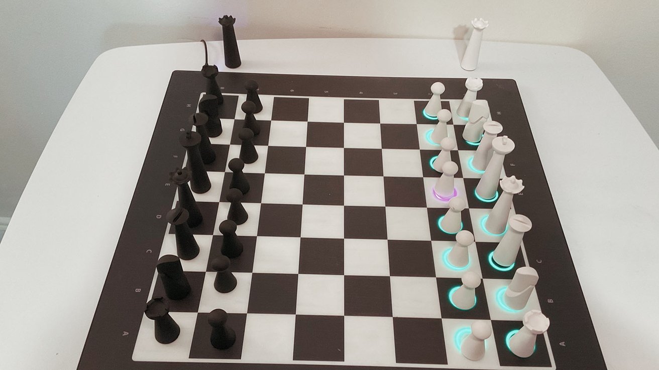 A chessboard with black and white chess pieces, some with glowing bases, set up for the start of a game.