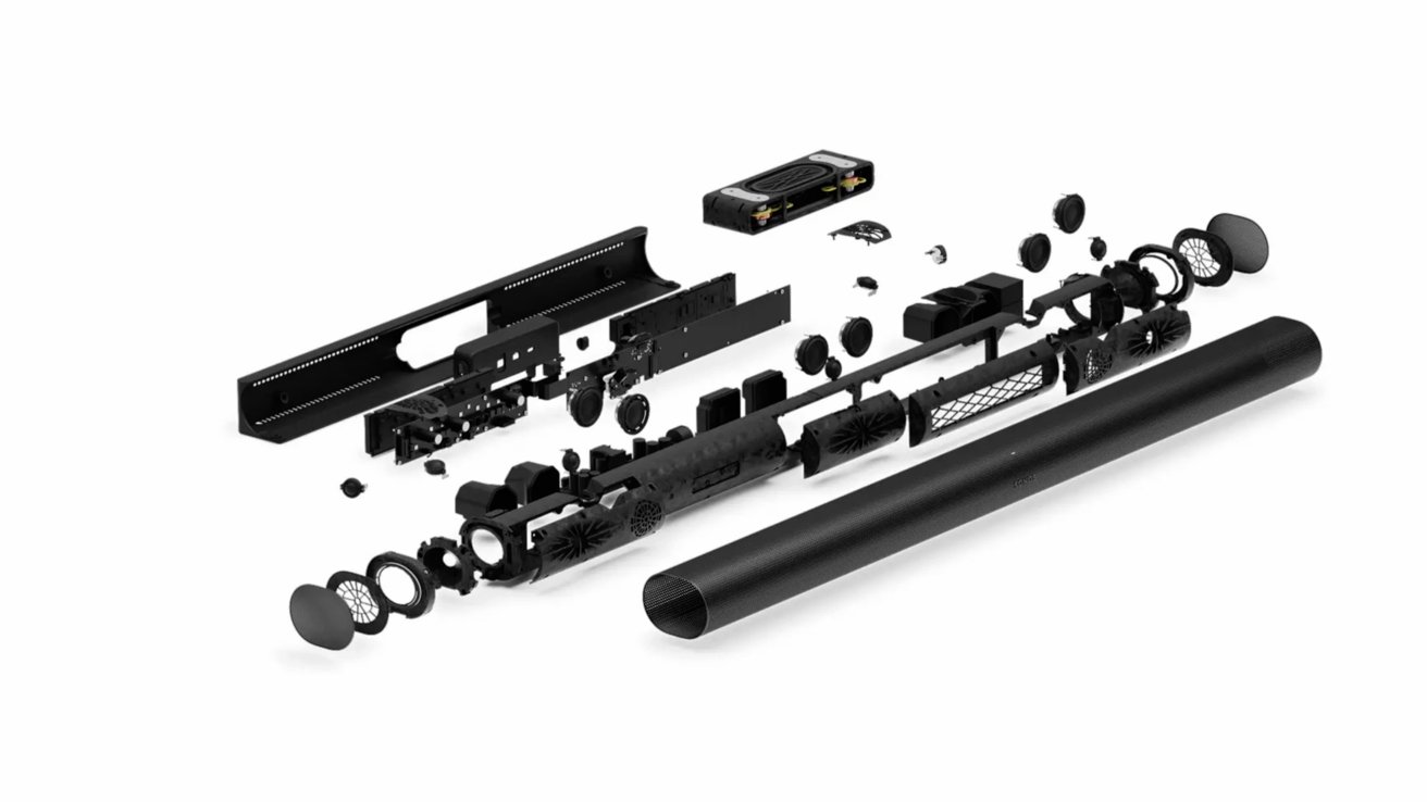 Exploded view of a soundbar, showing internal components like circuits, speakers, and casing parts arranged separately.