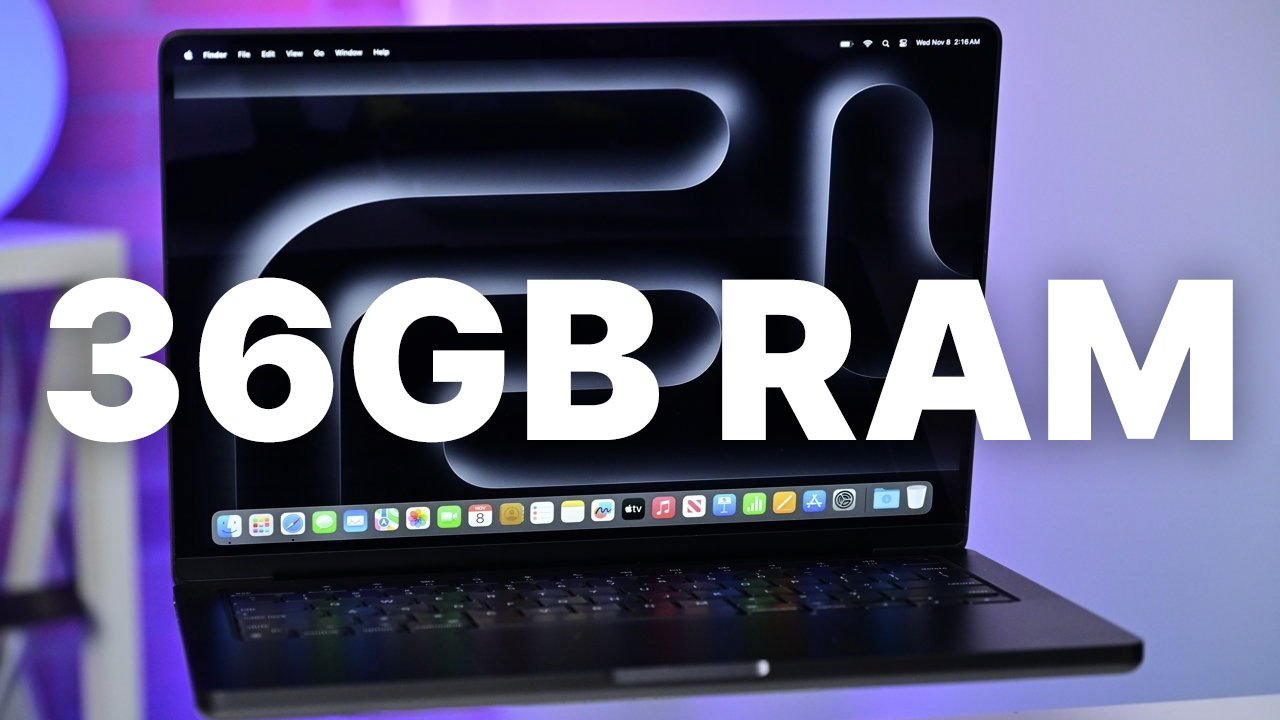 Apple MacBook Pro 14-inch displaying desktop wallpaper with bold text '36GB RAM' on screen.