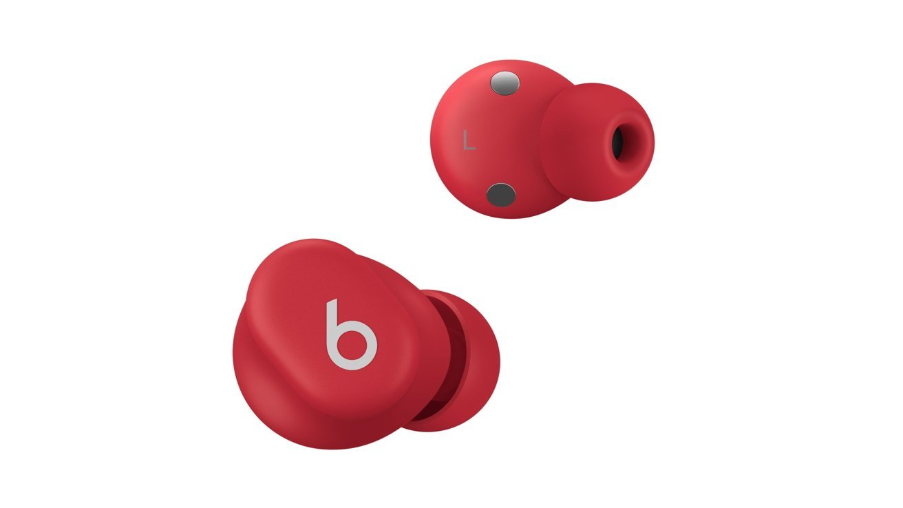 Two red wireless earbuds with a sleek design, one showing the letter 'L' and the other featuring a white 'b' logo.