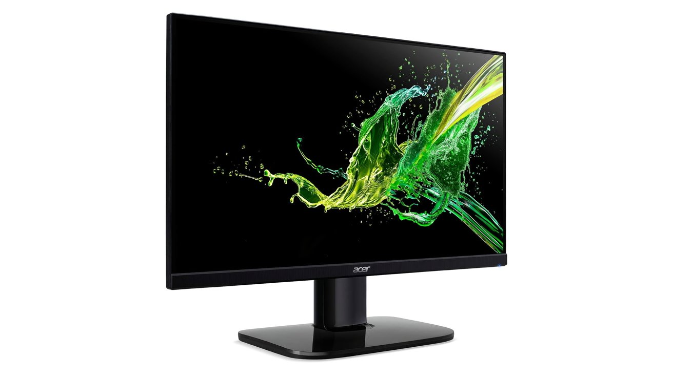 Acer monitor displaying vibrant green and yellow abstract splash on a black screen, mounted on a sleek black stand.